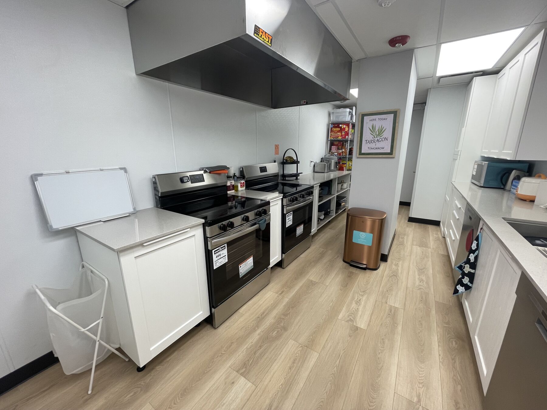 Stainless steel ranges and counters in a commercial childcare kitchen.
